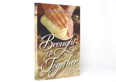 Brought Us Together book photo, showing hands kneading dough at the top of the cover with the title at the bottom