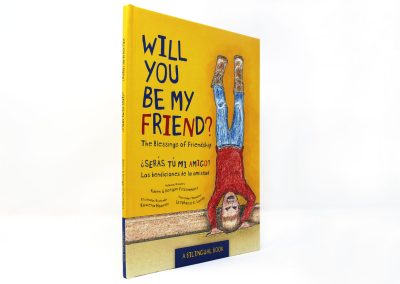 Will You Be My Friend? book photo, showing boy doing handstand against a yellow wall, with the title in English and Spanish