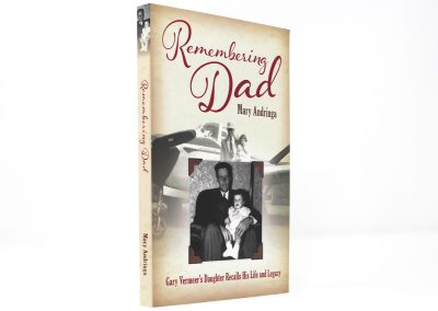 Remembering Dad book photo showing title in red at the top, with a faded photo of an airplane in the back and a photo of a little girl and her dad at the bottom