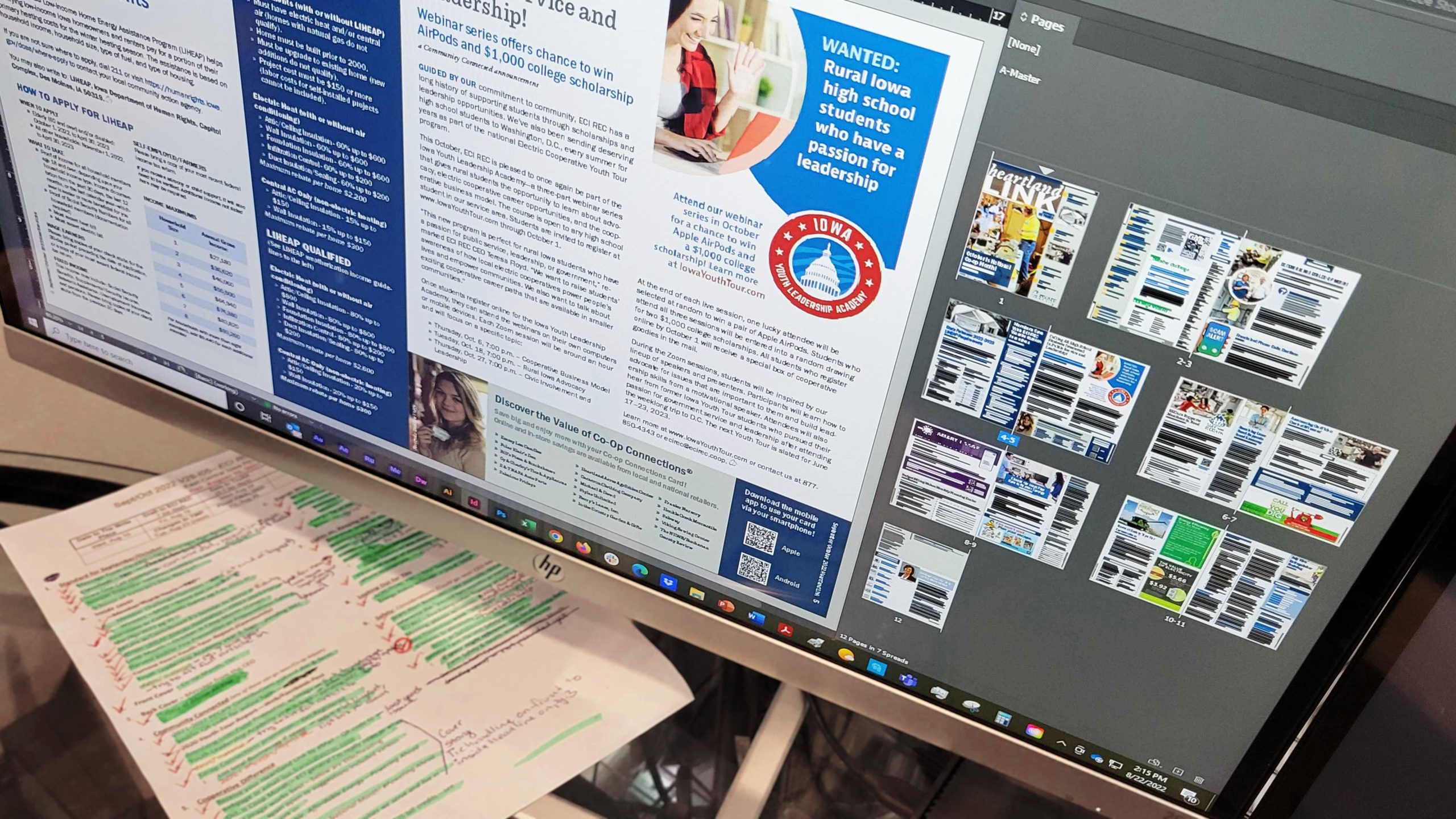 Photo of a newsletter layout in InDesign on a computer screen