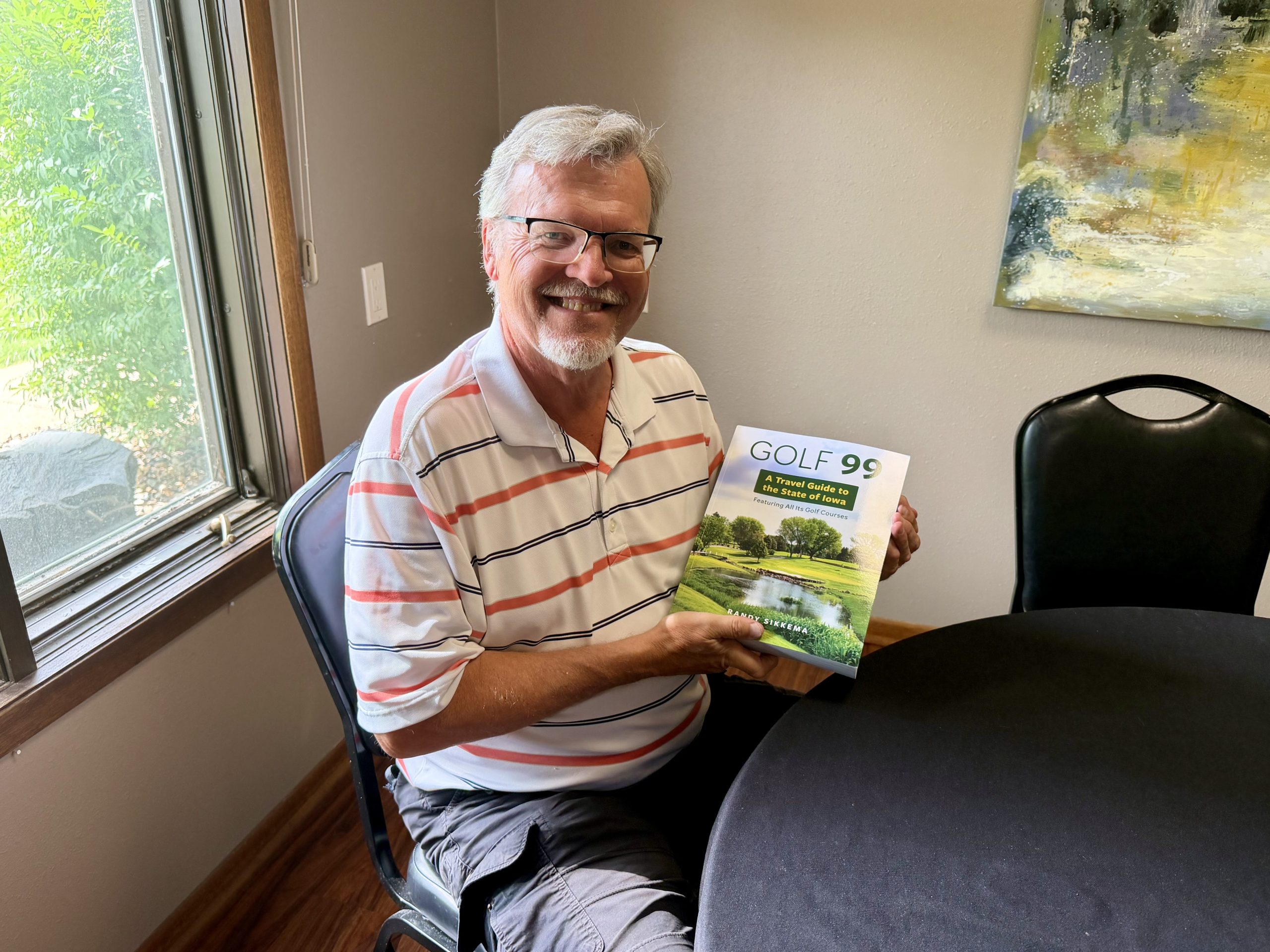IMG_1621 Randy Sikkema holding a copy of Golf 99